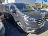 a silver van that is parked in a parking lot