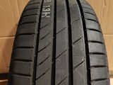 a close up of a tire on top of a cardboard box