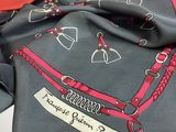a black scarf with a red and white design on it