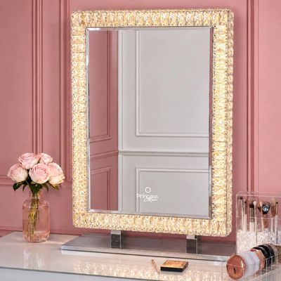 a mirror that is sitting on top of a table