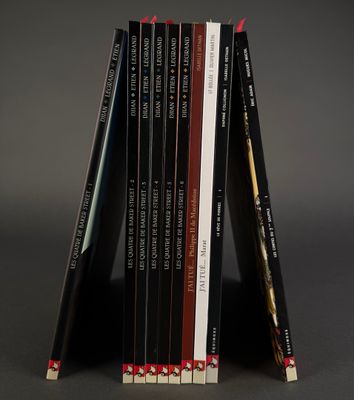 a stack of books sitting on top of each other on a table