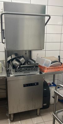 a kitchen with a sink, stove, and dishwasher in it