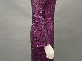 a purple sequinized dress on a mannequin mannequin mannequin mannequin mannequin mannequin mannequin mannequin