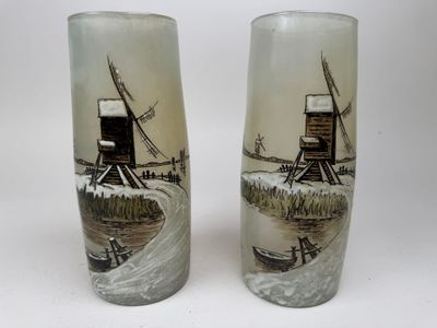 two tall glass vases with windmills on them