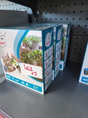 three boxes on the shelf in the store for sale