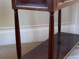 a small table with a drawer on top of it