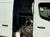 a white van that is parked on the side of the road