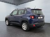 the back of a blue jeep compass parked in a garage