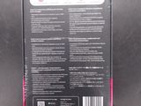 the back of a black box with a pink label on it