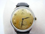 a watch that is sitting on top of a white cloth