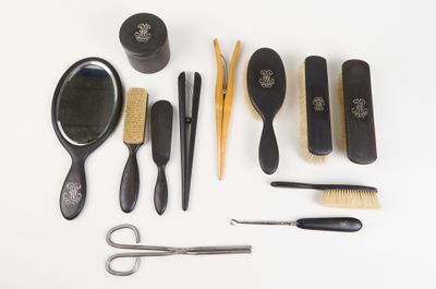 many different types of hair brushes and combs on the table
