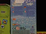 two boxes of toys on a table with a black background