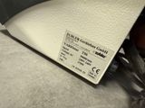 a close up of a label on the back of a chair