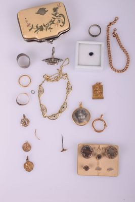 many different types of jewelry on a white surface