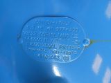 a close up of a tag on the side of a blue car