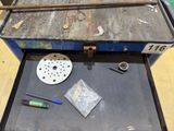 a tool box with tools on a table next to it