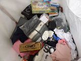 a pile of clothes and other items in a trash can