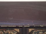a black table with a floral design on top of it