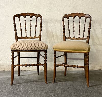 two chairs sitting next to each other on a cement floor