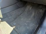 a close up of a car ' s floor mat in the back of a car