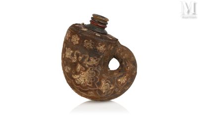 an old wooden bottle with a lid and a metal cap