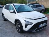 the white toyota c - hr is parked on the side of the road