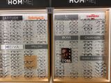 many glasses on display in the window of a store