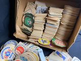 a cardboard box filled with lots of stickers and magnets