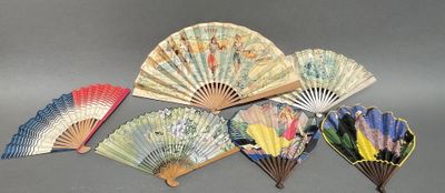 several different types of paper fans on a gray surface