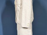 an image of a mannequin dress and jacket on a mannequin stand