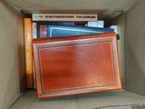 a box with books and a book case inside of it