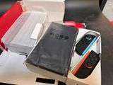 two nintendo wii controllers sitting in a box on a table