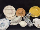 many different plates and bowls on a black table