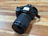 a camera that is sitting on a wooden table