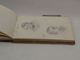 an open book with a drawing of a woman and a man on it