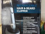 a box of hair and beard clippers sitting on a table