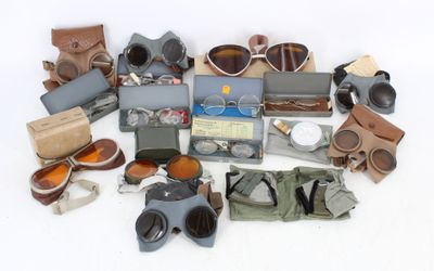 many different types of binoculars and other items on the table
