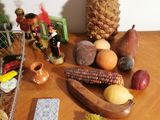 fruits and vegetables on a table next to a cell phone