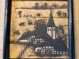 une image d'un tableau sur le mur d'une maison