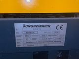 the back end of a yellow machine with a label on it
