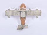 a toy airplane that is sitting on a white surface