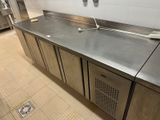 stainless steel counter top in a commercial kitchen with stainless steel cabinets