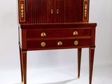 an antique writing desk with two drawers and gold trimming on the top