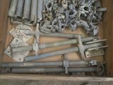 many bolts and screws in a wooden box