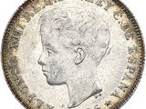 une pièce d'argent représentant le profil d'un homme