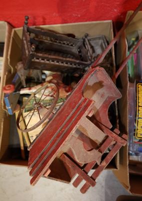 a box full of assorted items and a toy horse
