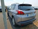 a silver car that is parked on the side of the road