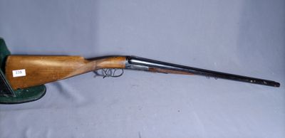 a rifle with a wooden barrel and a metal muzzle on a white background
