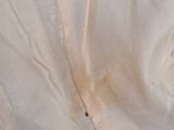 a close up of a piece of fabric with a hole in it