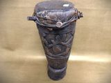 a wooden vase with a decorative design on it